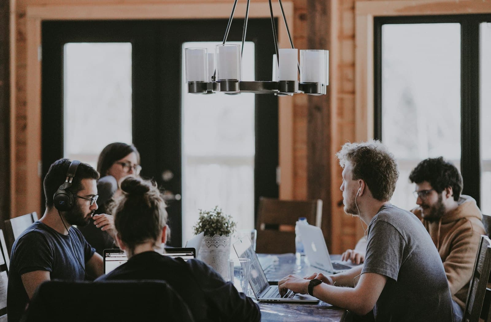A team of founders working together around a shared table